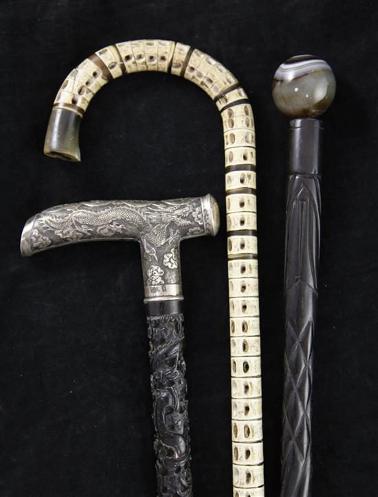 A walking stick & two canes